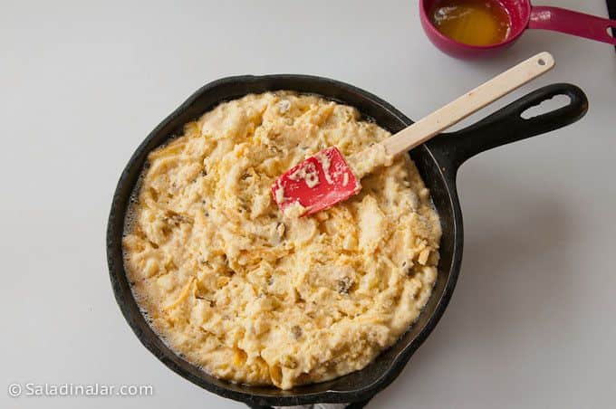 spreading batter in skillet