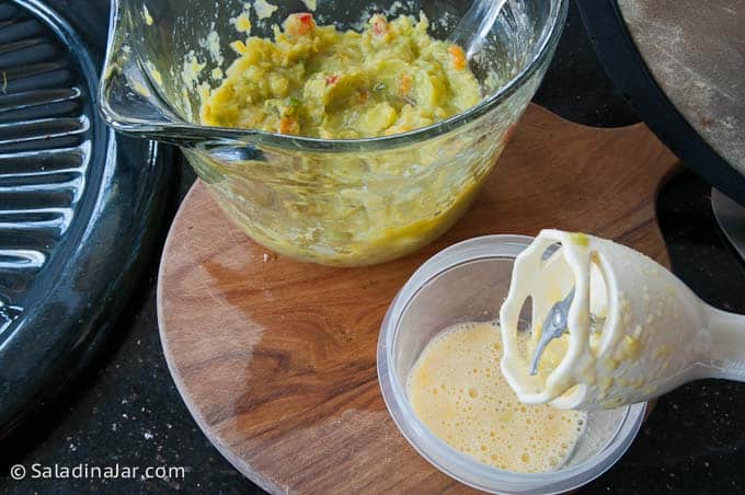 mixing egg with immersion blender