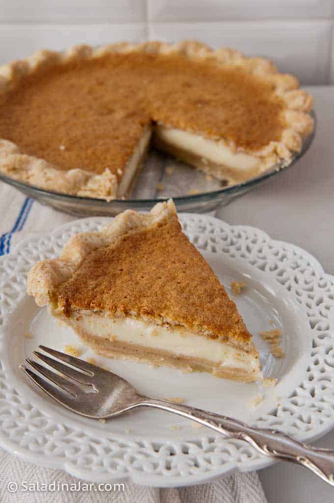 Grandma's Magical Layered Custard Pumpkin Pie Slice taken from whole pie.