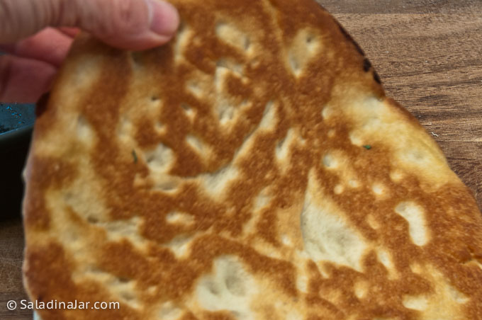 gorgeous golden brown and crispy underneath side of pizza