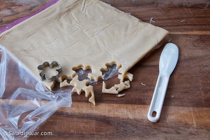 Cutting out Shamrock Shortbread Cookies with a cookie cutter