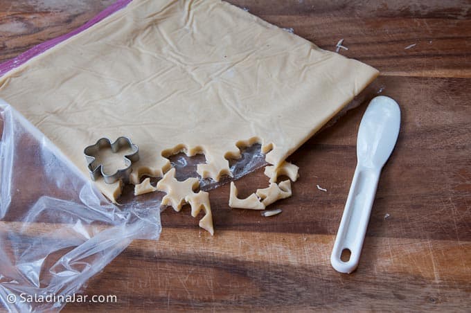 Cutting out Shamrock Shortbread Cookies with a cookie cutter