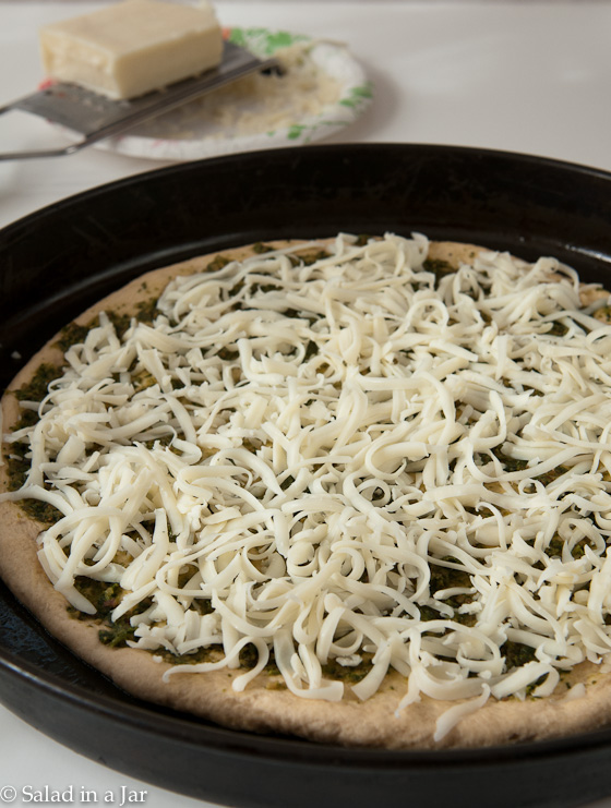 cheese layer on chicken and pesto pizza