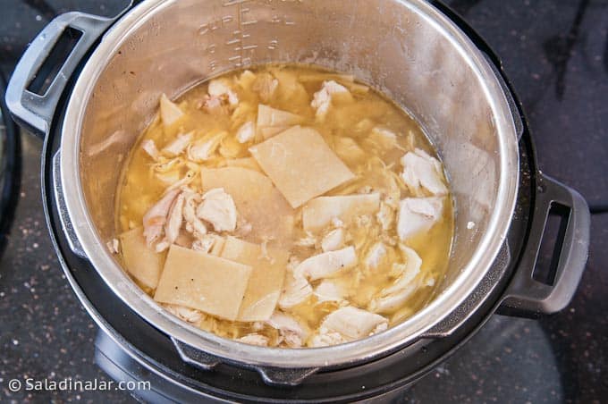 adding chicken to the pan