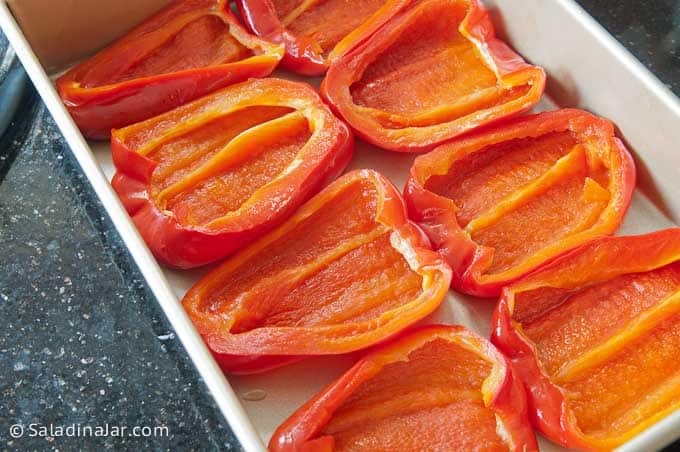 baked red peppers, flipped over and ready for filling
