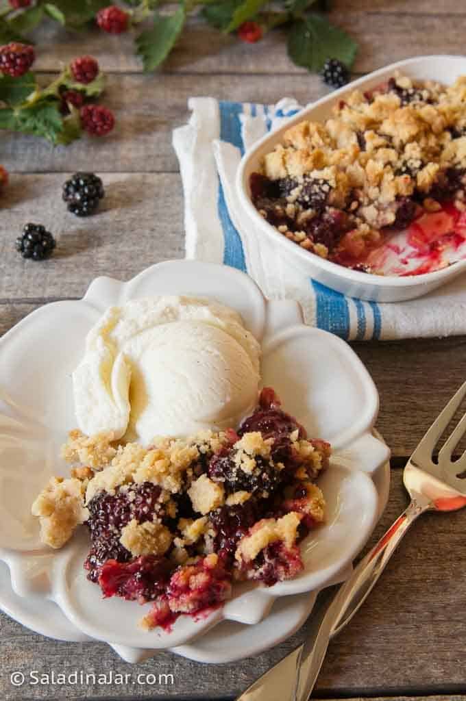 Speedy Blackberry Cobbler with an Easy Shortbread Crust on a plate with ice cream
