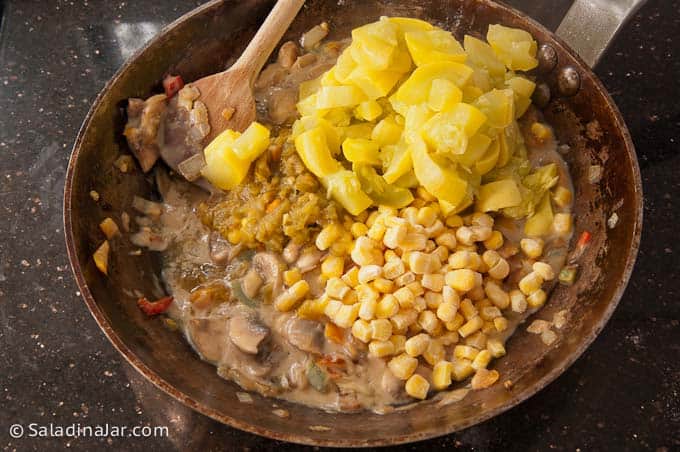 adding ingredients to a large pan.