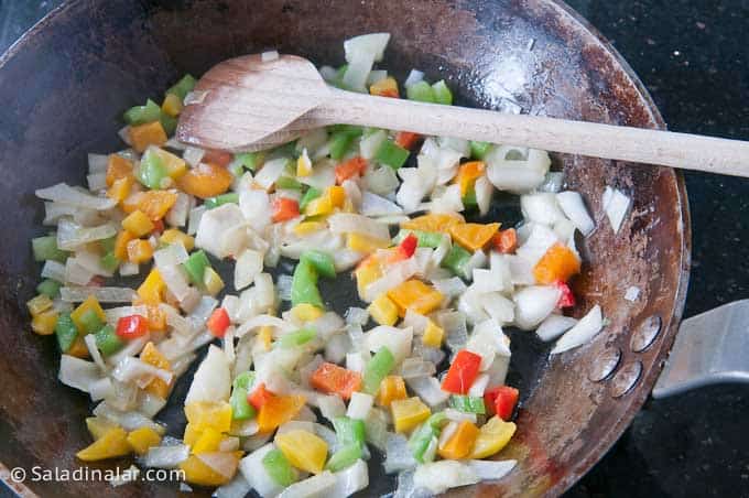 sauteing veggies on the stove.