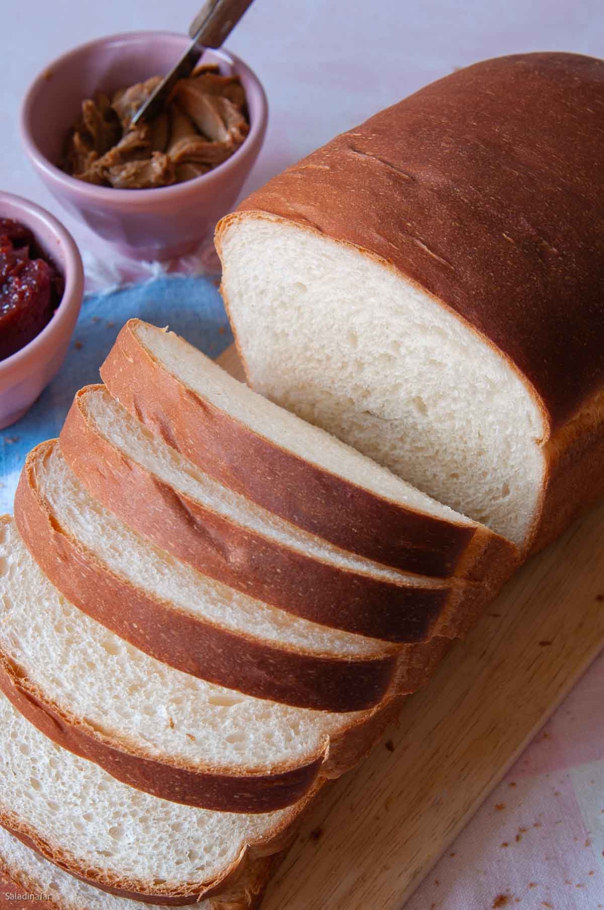 sliced loaf of condensed milk bread machine loaf