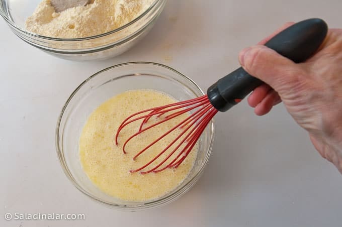 whisking the eggs, oil, and butter together