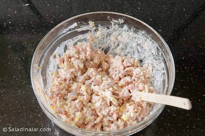 combining all ingredients for ham salad