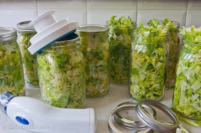 vacuum-sealing jars of cut lettuce