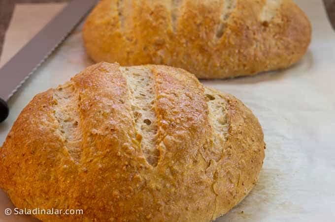 baked loaves on parchment-covered baking sheet