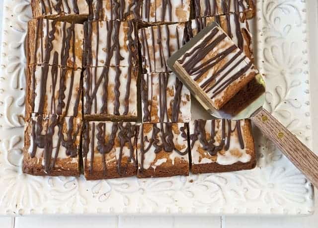 sliced peanut butter squares with spatula