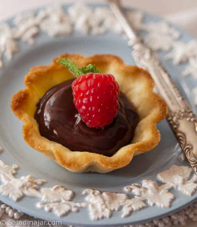 individual chocolate ganache mini-tart in vanilla cookie shell