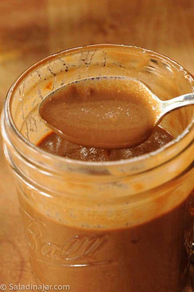 Low-Calorie Salad dressing in a pint  jar and spoon