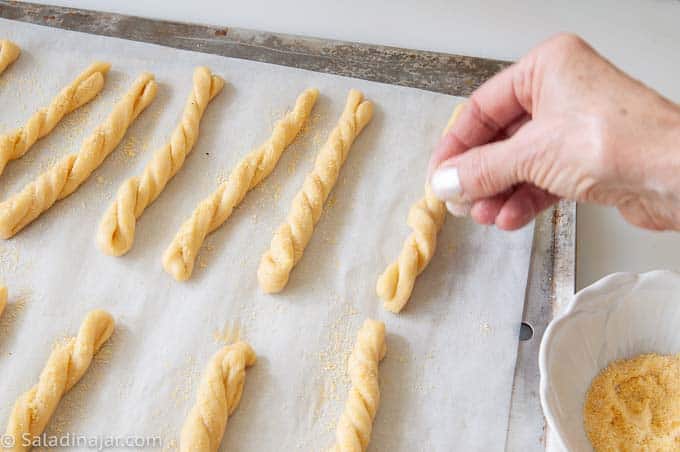 sprinkling cormeal on top of cornbread sticks