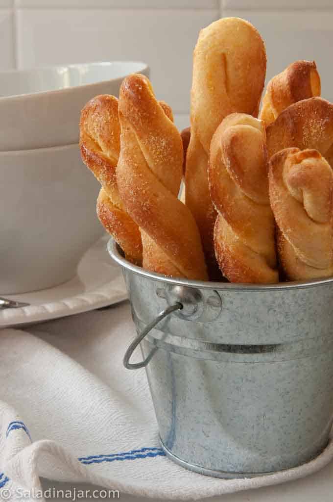 backed cornbread sticks in a bucket