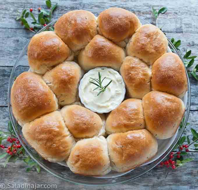 Christmas dinner wreath made with rolls and whipped butter in the middle