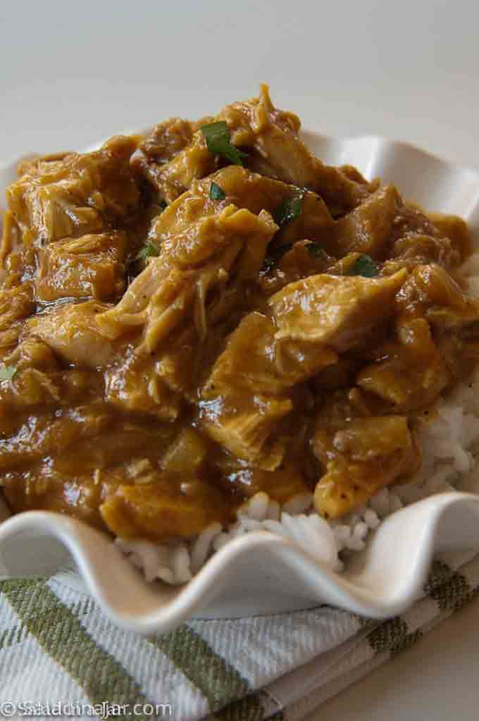 Easy Rotisserie Chicken Curry - served over rice  in a bowl