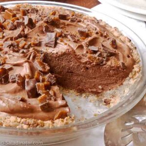 Sliced French Silk pie with a pecan cookie crust.