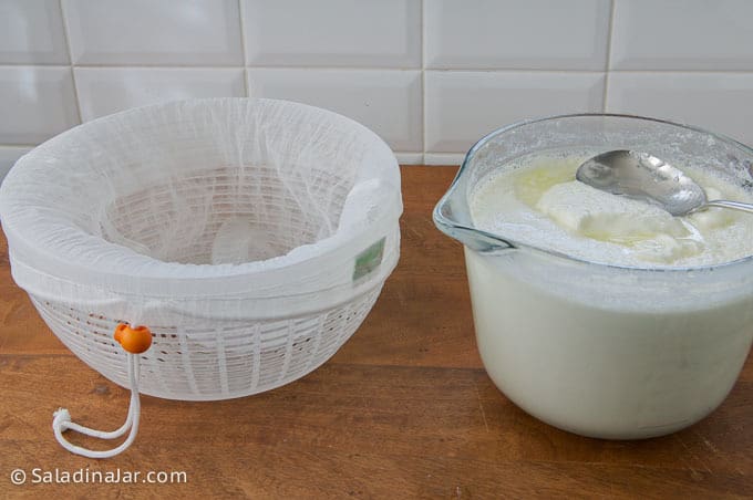 straining yogurt with a nut pouch or yogurt bag