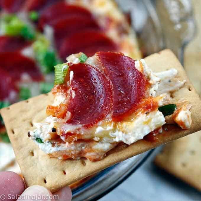 Pepperoni Pizza Dip - individual serving on a cracker