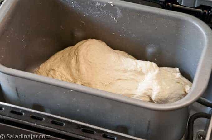 dough mixed in bread maker machine pan