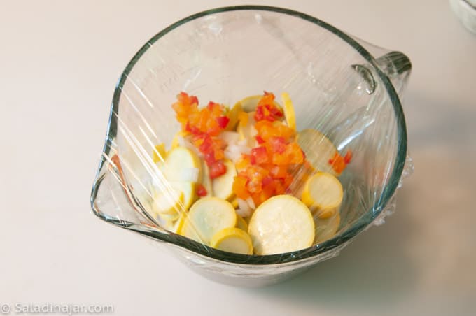 Cooking squash and peppers in the microwave.