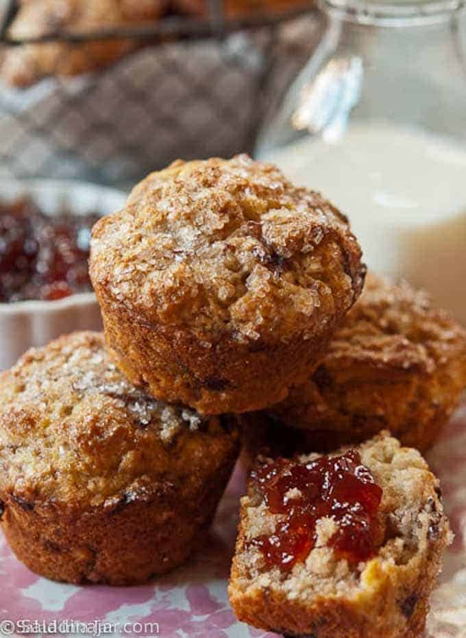 Strawberry, Balsamic Muffins with Goat Cheese with one muffin spread with jelly.