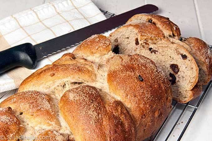 baked braided banana yeast bread with a slices to show texture.
