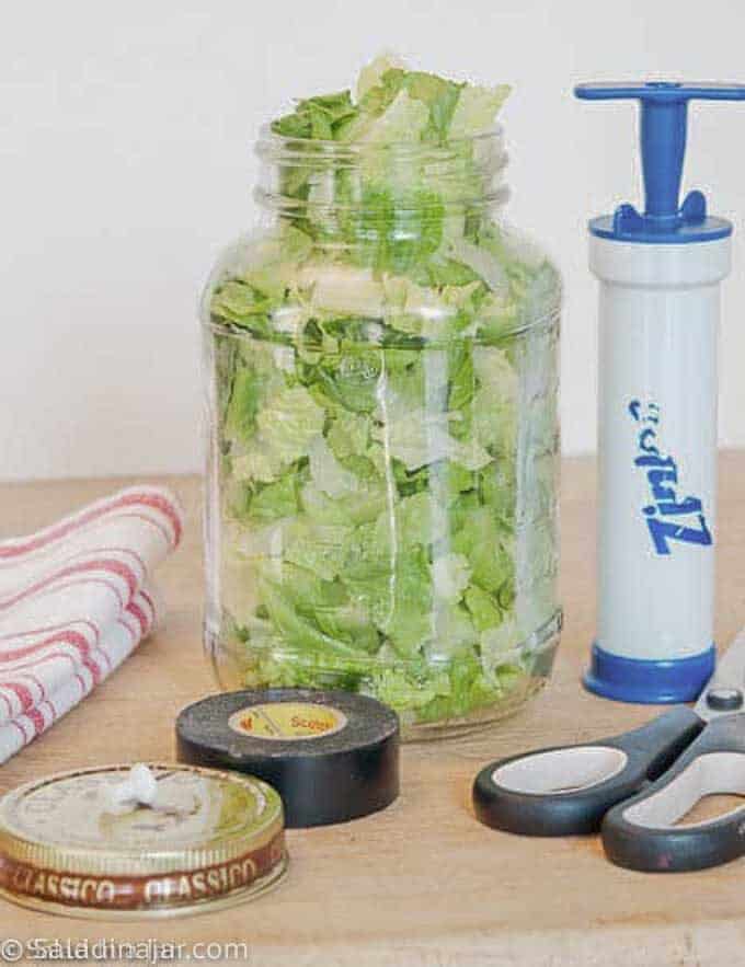 jar of lettuce and all supplies needed to vacuum-pack it cheaply