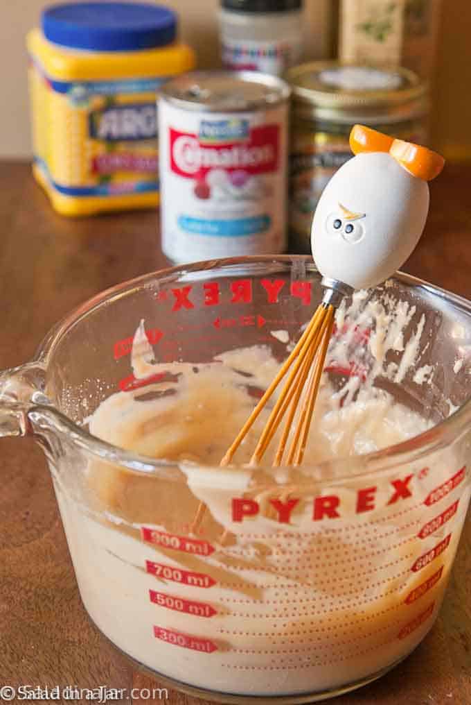 mixing soup with a whisk