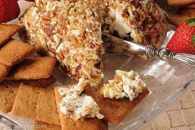 Dessert cheese ball that has been sliced into to show texture.