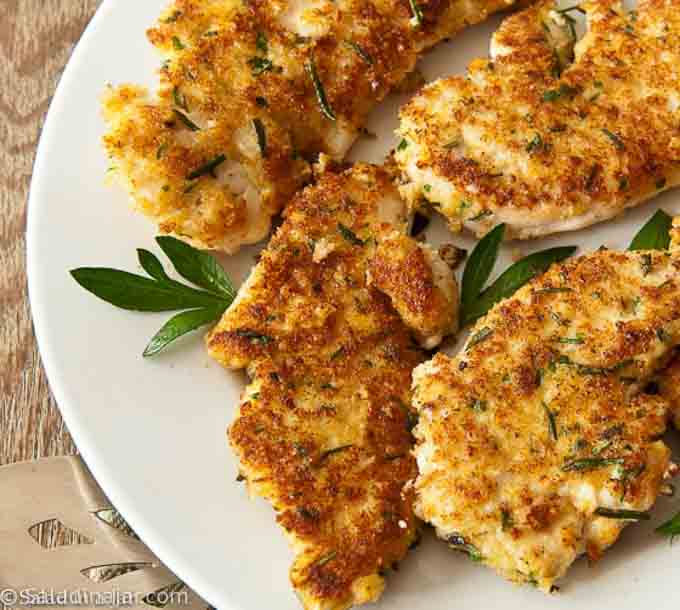 breaded chicken filets on a serving platter