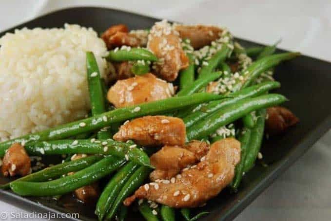 Chicken and Green Bean Stir-Fry with Sesame Seeds, on a plate with rice