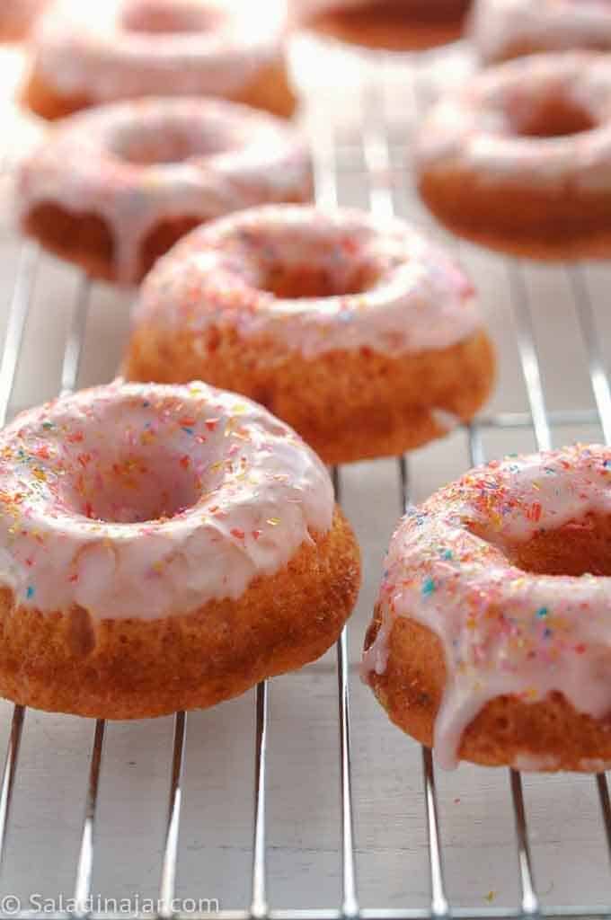 FROSTED STRAWBERRY CAKE DONUT Recipe - on a rack
