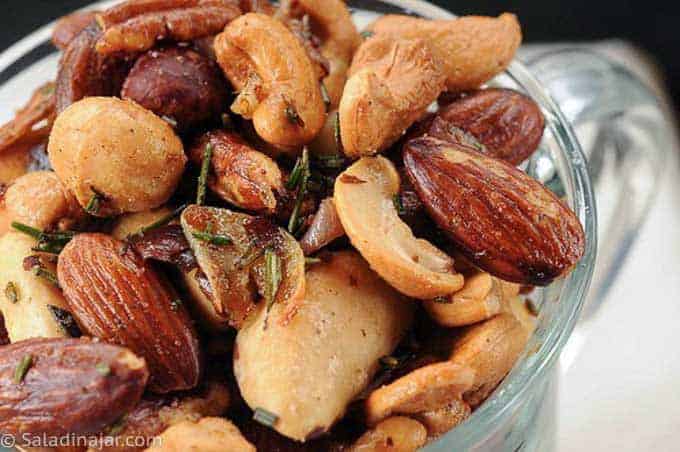 A cup of rosemary roasted nuts