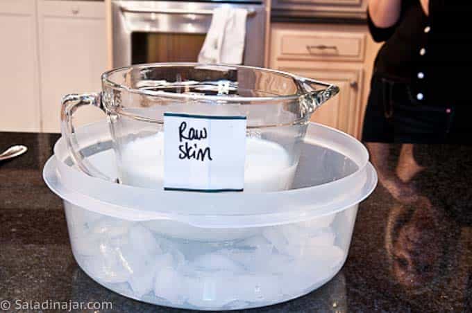 cooling milk in a bowl of ice