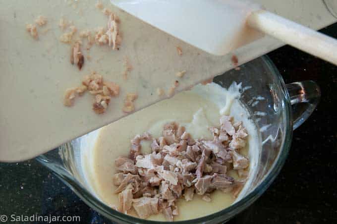 Add sour cream, milk, and chopped cooked chicken.