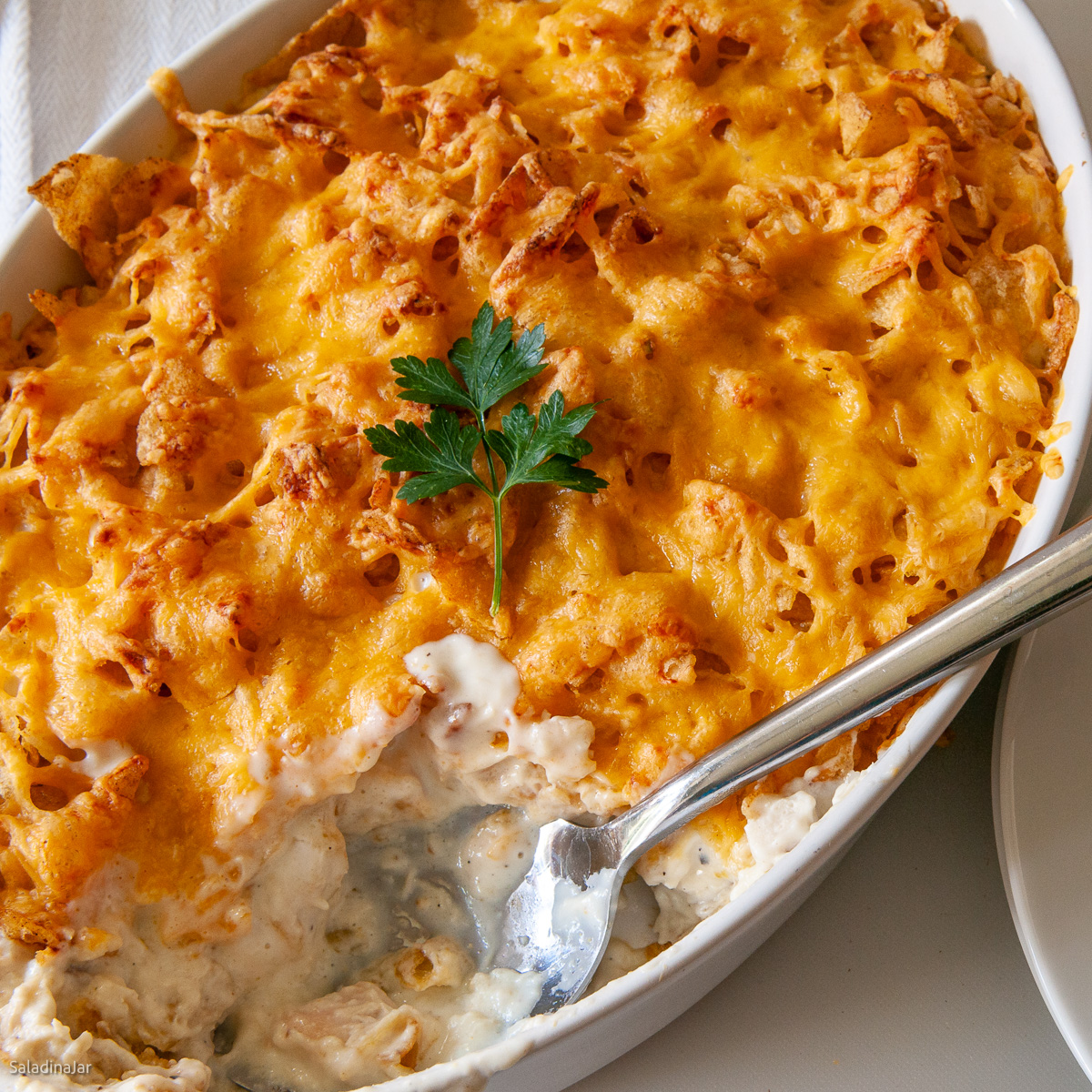potato chip casserole with a spoon to serve