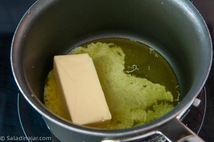 melting butter in a pan on the stove
