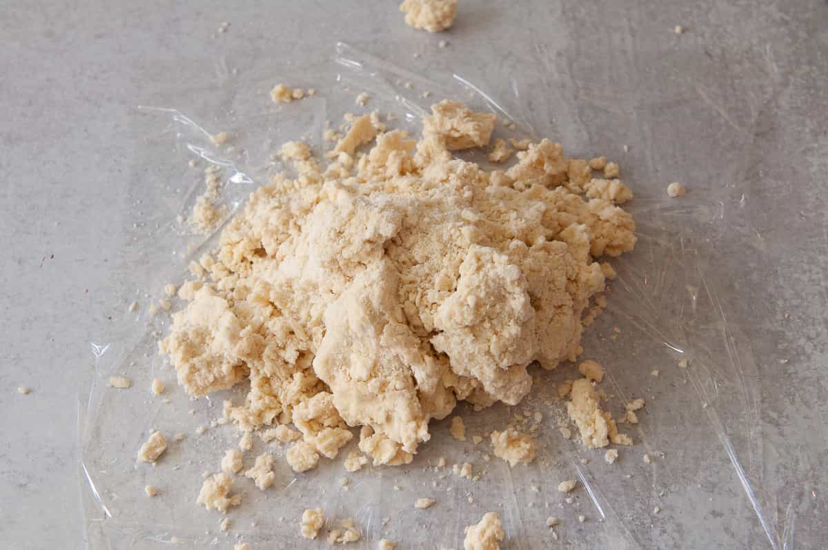 pie crust dough (crumbles) poured out on the counter.