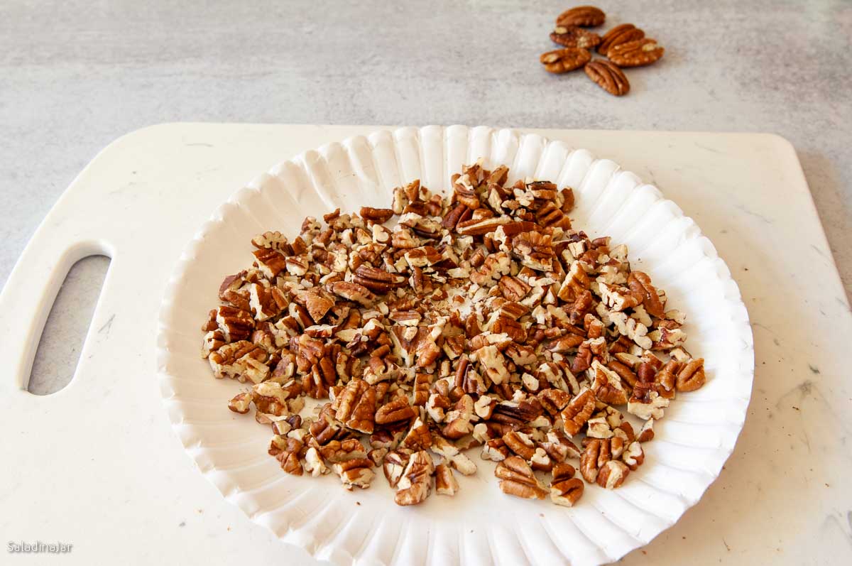 pecans toasted on a paper plate in the microwave.
