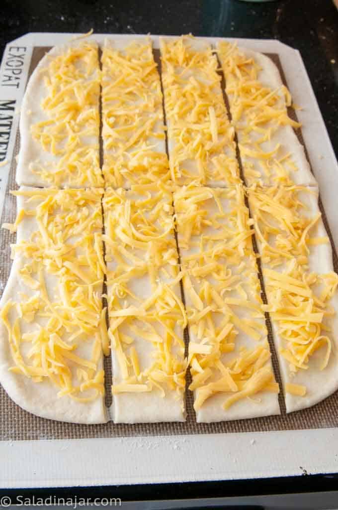 8 strips of dough covered with cheese
