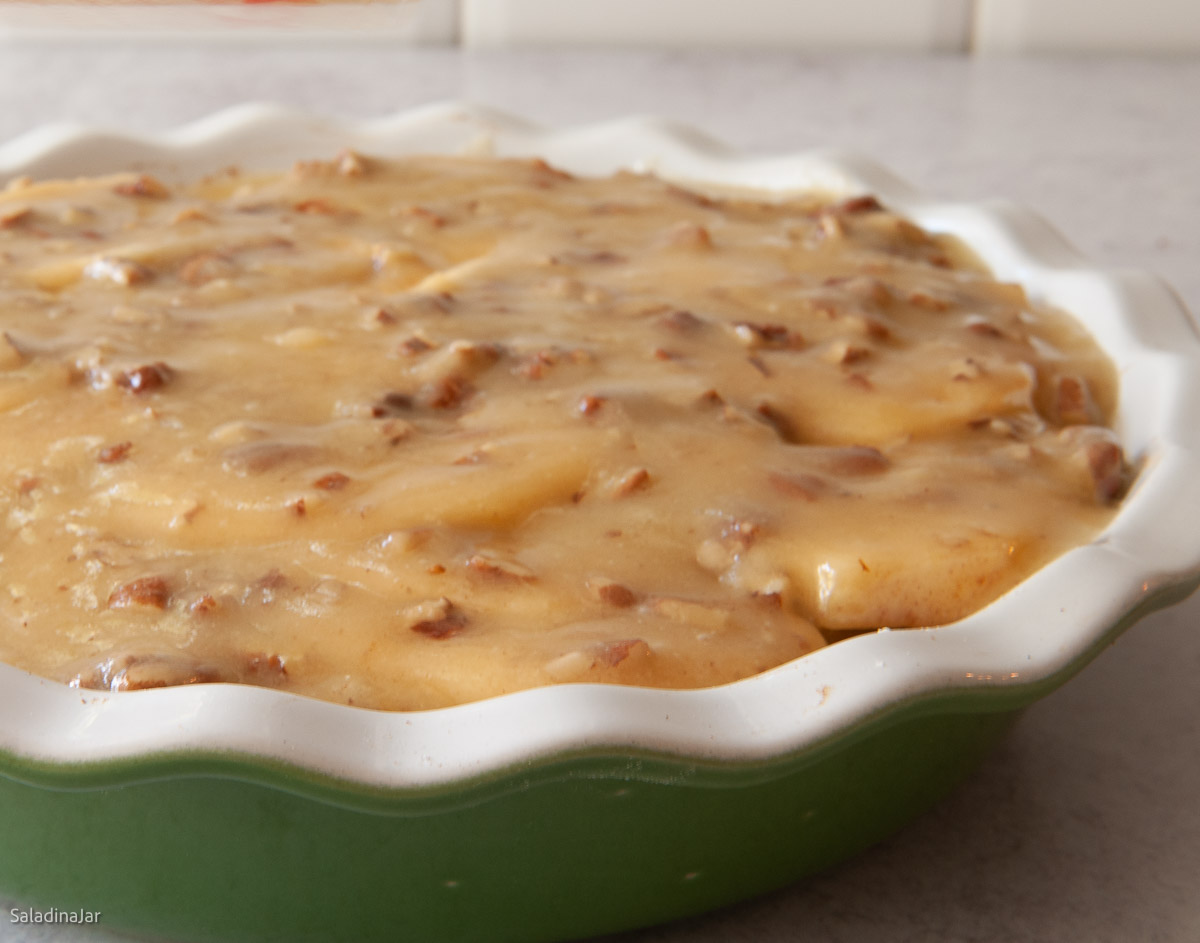 batter spread over the raw apples