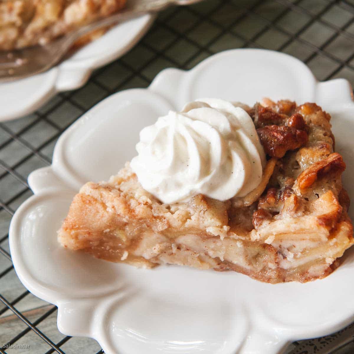 slice of crustless apple pie on a plate.