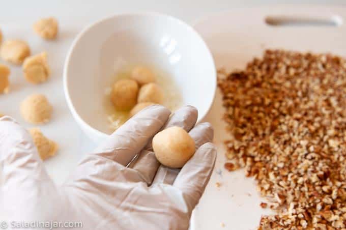 rolling portioned dough into balls