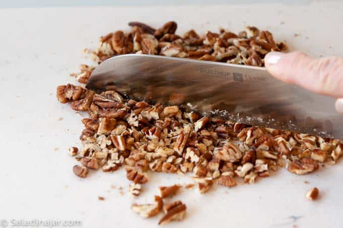 chopping pecans finely