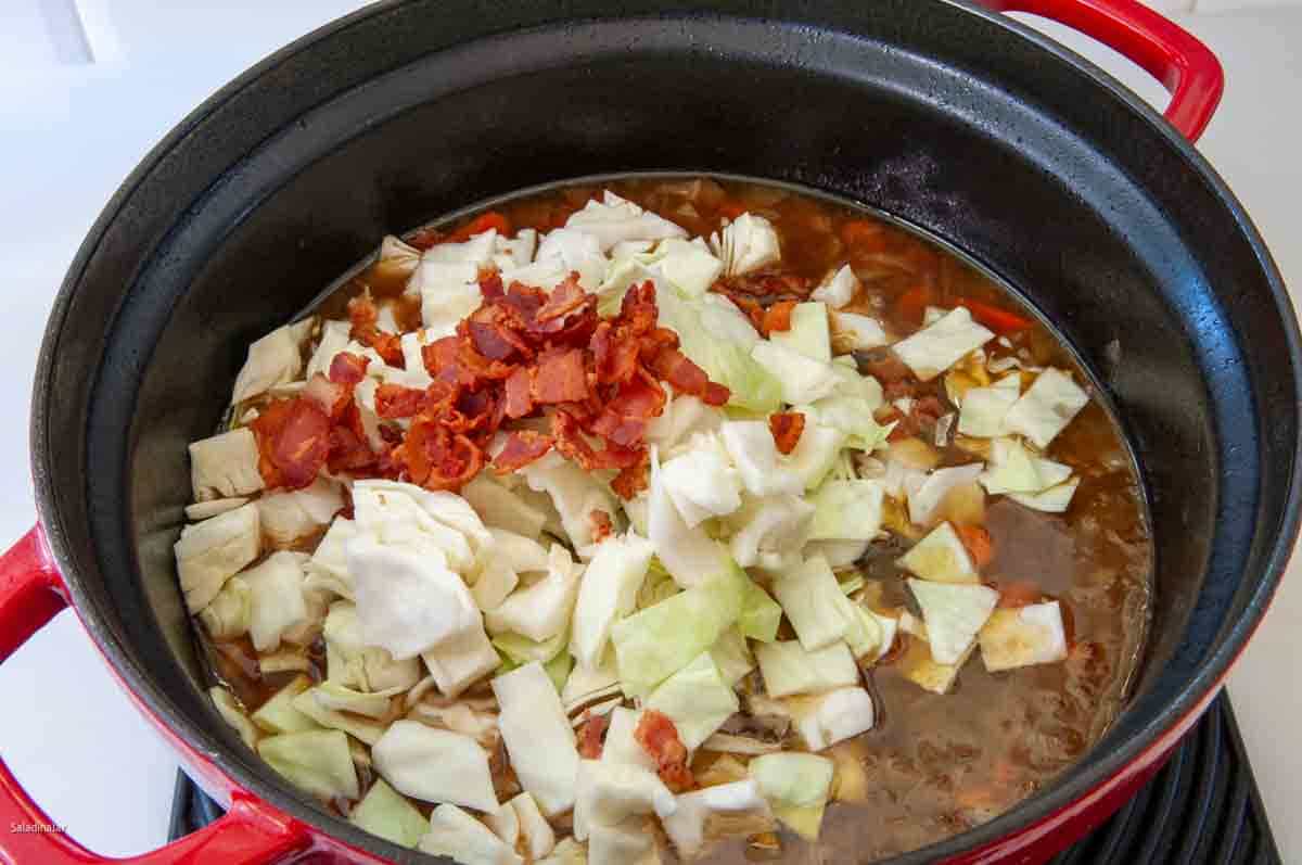 Cabbage and bacon bits added to the stew ten minutes before serving.